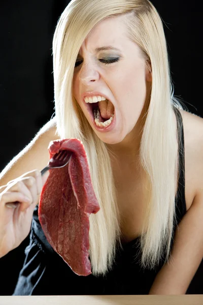 Portrait of woman with raw meat — Stock Photo, Image
