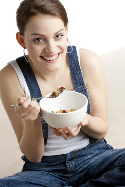 Portrait of woman eating cereals — Stok fotoğraf