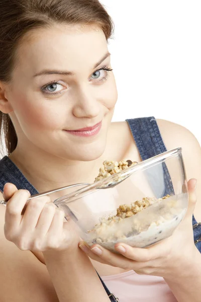 Portrait of woman eating cereals — Stok fotoğraf