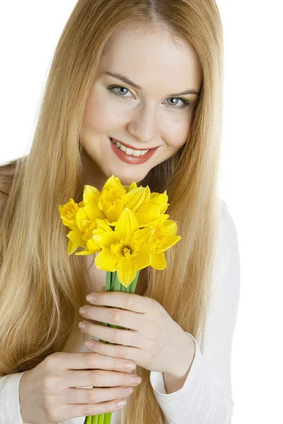 Portrait of young woman with daffodils — Stock Photo, Image