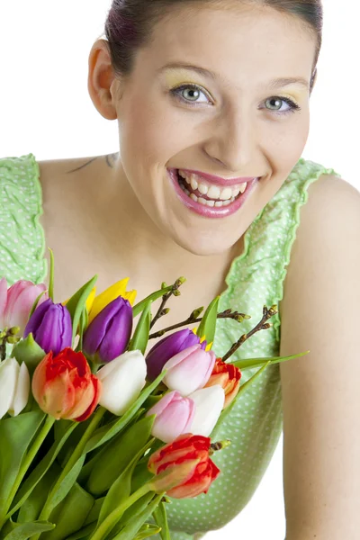 Portrait of young woman with tulips — Stock Photo, Image