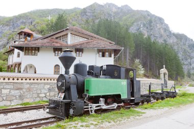 Steam locomotive in front of Dobrun Monastery, Bosnia and Herceg clipart