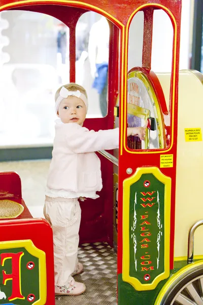 Standing toddler on carousel — Stock Photo, Image