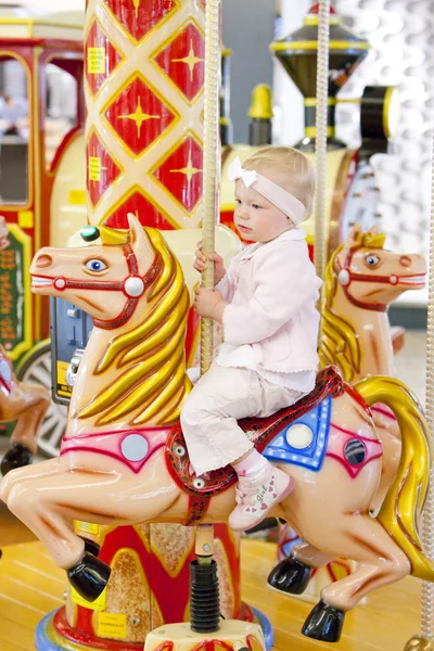 stock image Sitting toddler on carousel