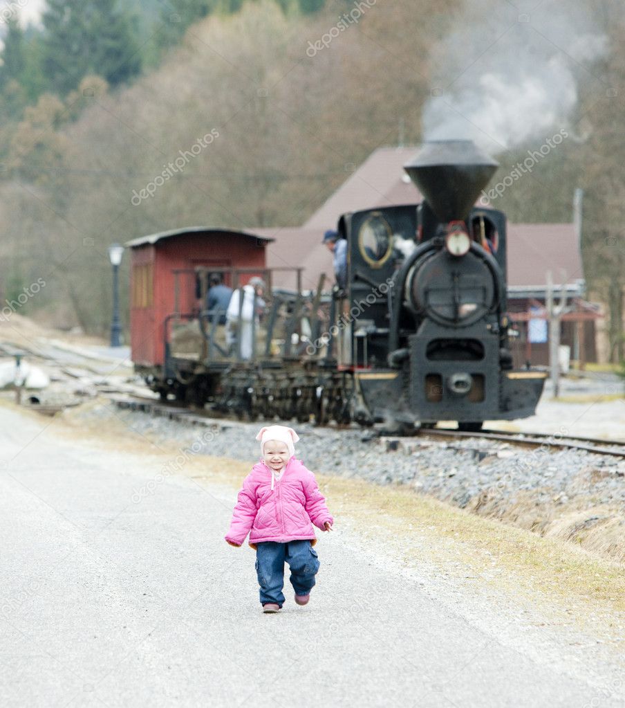 Litte girl and steam train, Ciernohronska Railway, Slovakia
