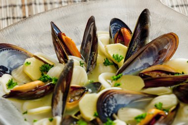 Mussels soup with pasta orecchiette clipart