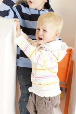 Standing and crying little girl