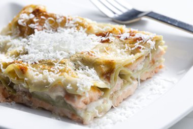 Spinach lasagne with salmon clipart