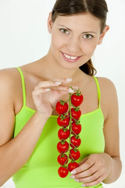 Portrait of woman holding tomatoes — Stock Photo, Image