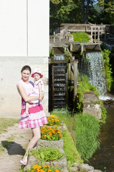 Mother with her daughte at water mill in Ratiborice, Czech Repub — Stock Photo, Image