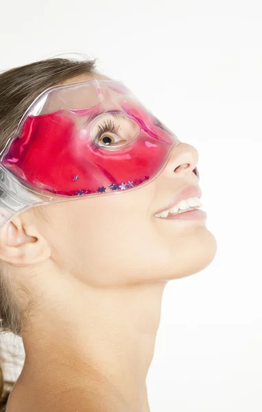 Portrait of young woman with cooling facial mask — Stock Photo, Image