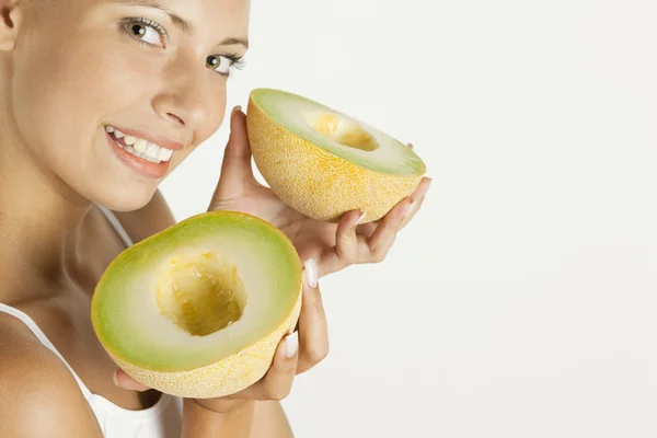 Portrait of woman with melon galia — Stock Photo, Image