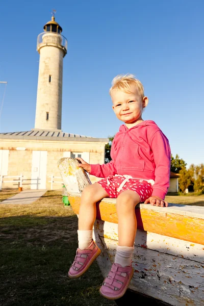 Sitting little girl, Richard Lighthouse, Afbaine, France — стоковое фото