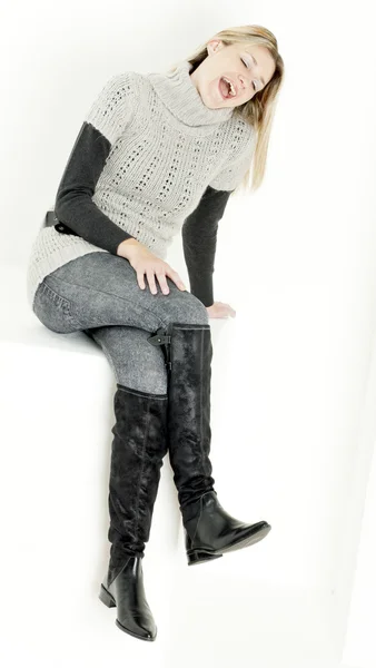 Sitting woman wearing fashionable boots — Stock Photo, Image