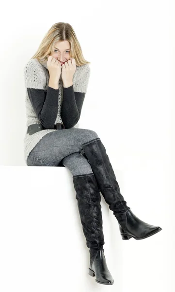 Sitting woman wearing fashionable boots — Stock Photo, Image