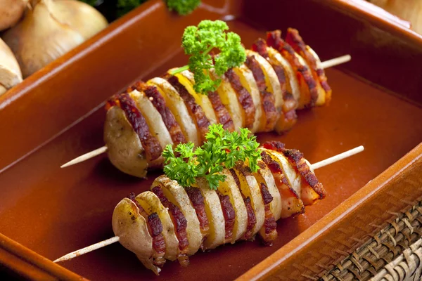 Potato skewers with bacon — Stock Photo, Image