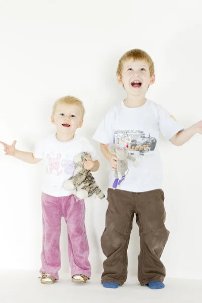 Standing children with toys — Stock Photo, Image