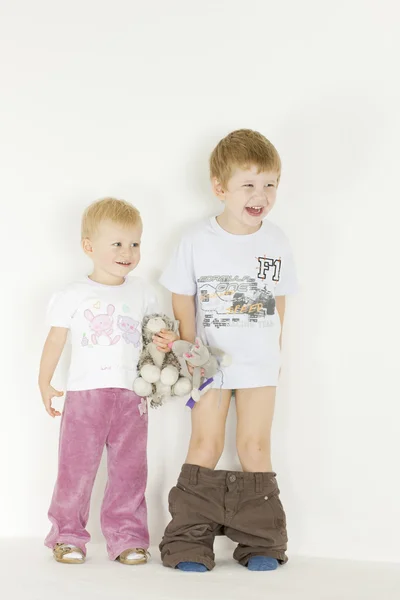Standing children with toys — Stock Photo, Image