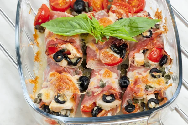 Baked ham rolls filled with chicken meat and black olives