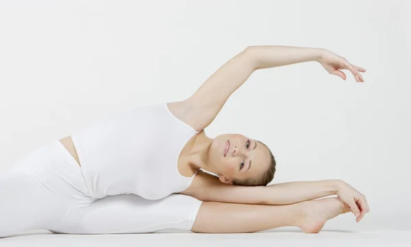Portrait of ballet dancer doing stretching