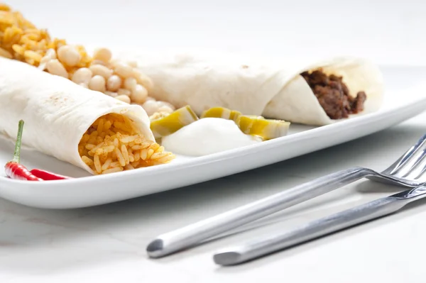 Beef burritos with beans and rice — Stock Photo, Image