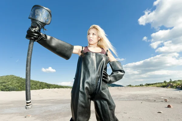 Standing woman with gas mask wearing protective clothes — Stock Photo, Image