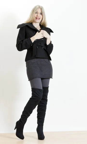 Standing woman wearing fashionable black boots — Stock Photo, Image