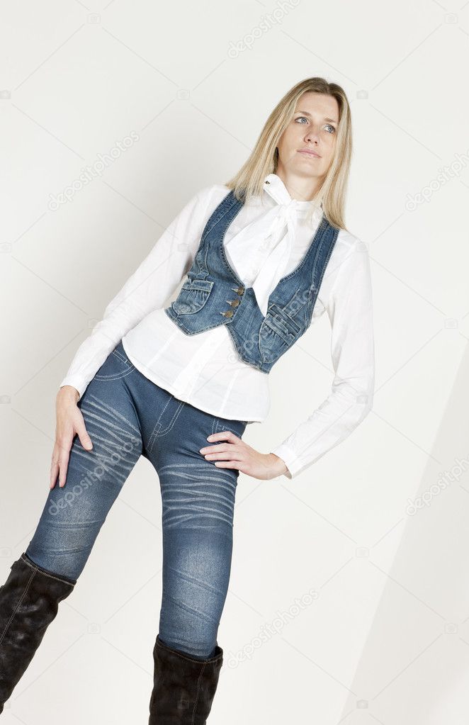 Standing woman wearing fashionable clothes