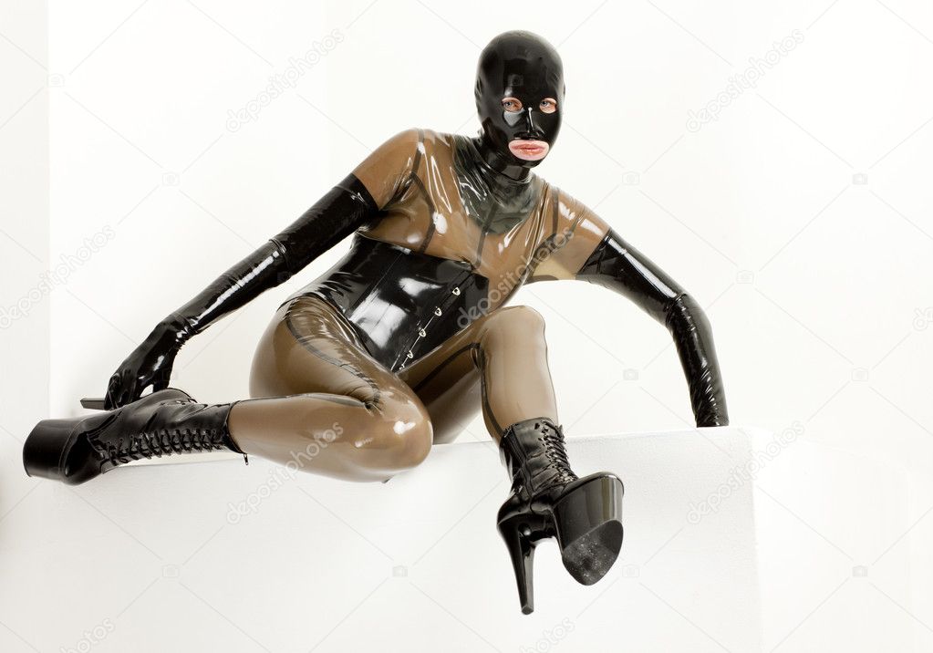 Sitting woman wearing latex clothes