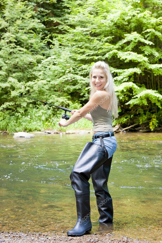 Fishing Woman With Landing Net Standing On Pier Stock Photo