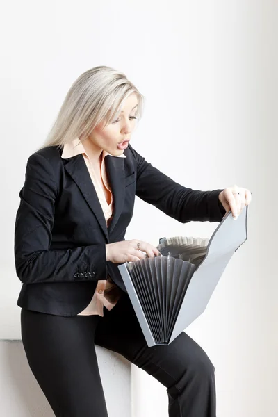 Portrait of young businesswoman with folders — Stock Photo, Image