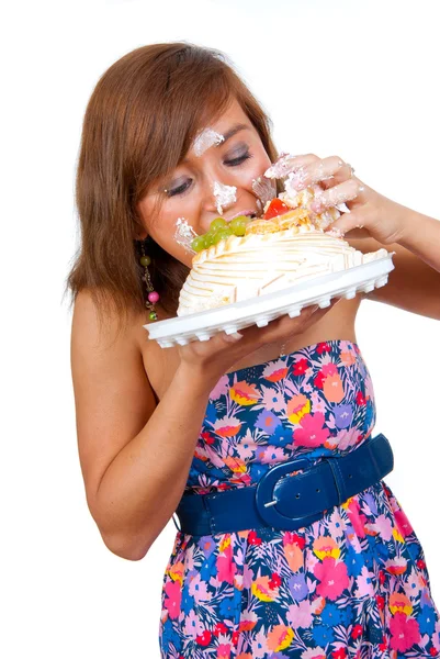 Girl eating cake with his hands — Stock Photo, Image