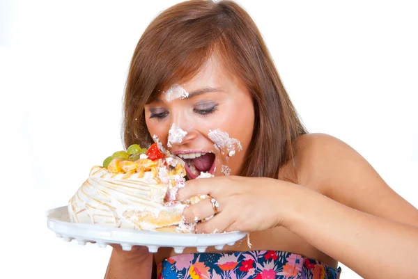 女孩吃蛋糕用他的手 — 图库照片