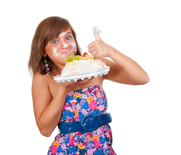 女孩吃蛋糕用他的手 — 图库照片