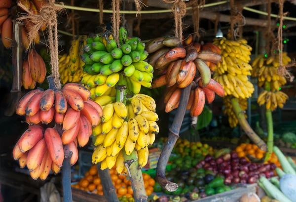 Many tropical fruits in outdoor market — Stock Photo, Image
