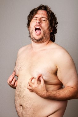 Man pleasuring his own nipples clipart