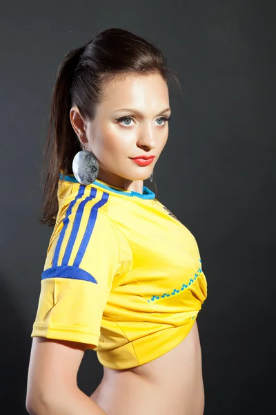 stock image Pretty model posing in Ukraine soccer jersey in studio