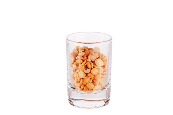 Shot glass filled with peas — Stock Photo, Image