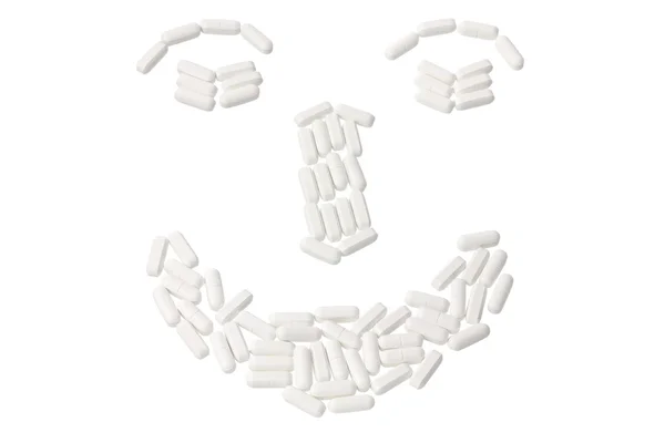Pills Arranged in Shape of Face — Stock Photo, Image