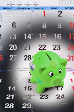 Piggy Bank on Calendar Pages clipart