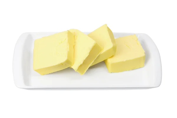 Rebanadas de mantequilla en la placa — Foto de Stock