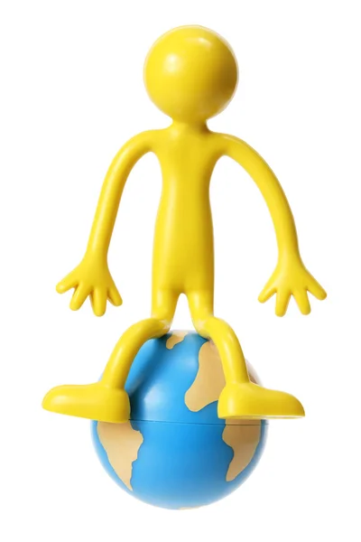 Figura de borracha em miniatura com globo — Fotografia de Stock