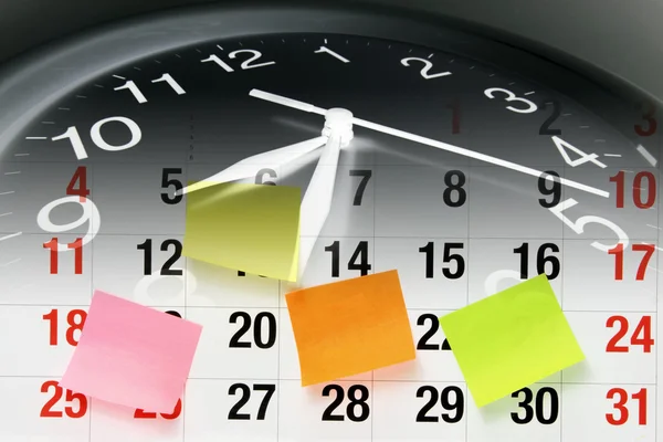 Uhr und Kalenderblatt — Stockfoto