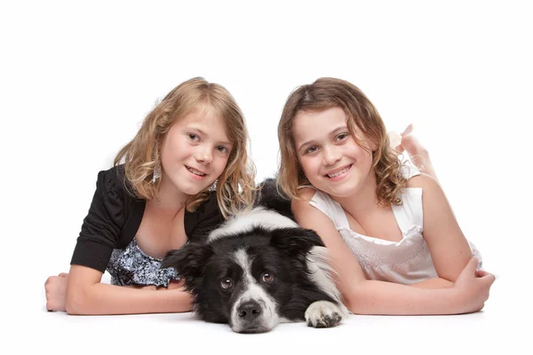 Two girls and a dog — Stock Photo, Image