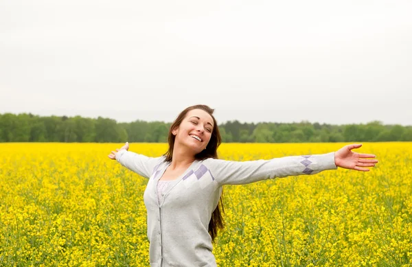 Happy young woman cheering — Stock Photo, Image