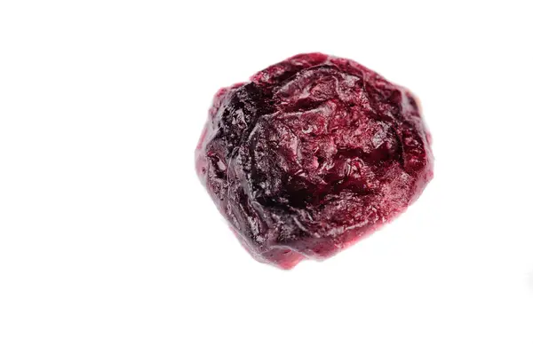 A single cranberry against a white background — Stock Photo, Image