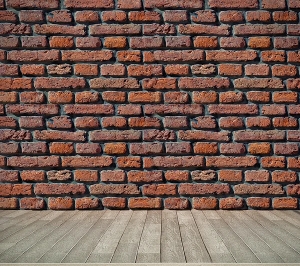 れんが造りの壁とフローリングの床 — ストック写真