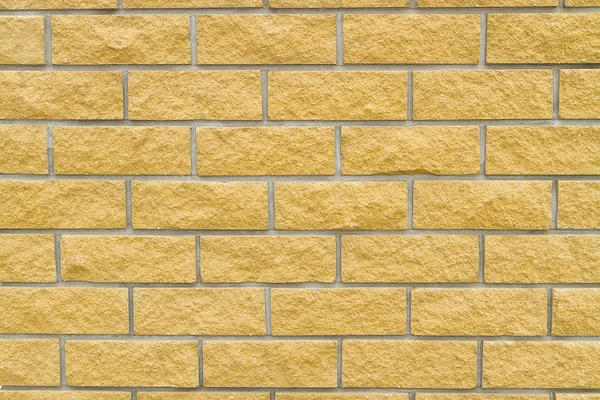 Mur z cegły żółty kamienia — Zdjęcie stockowe