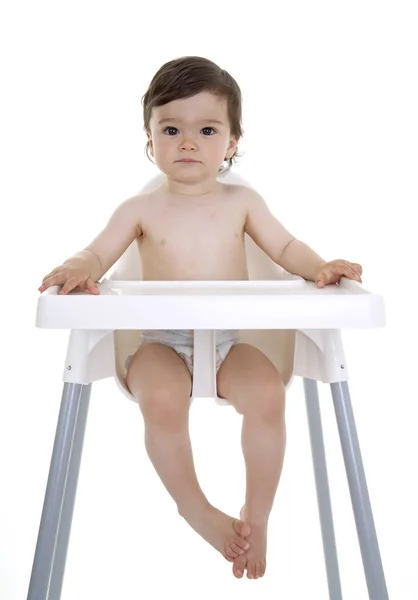 赤ん坊は高い椅子に座って — ストック写真