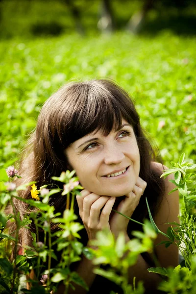 Beautiful woman on the meadow on a warm summer day — Stock Photo, Image